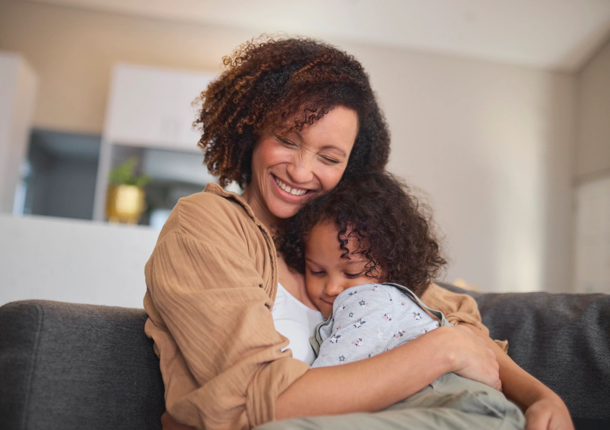 Mother and child sharing a comforting moment at home